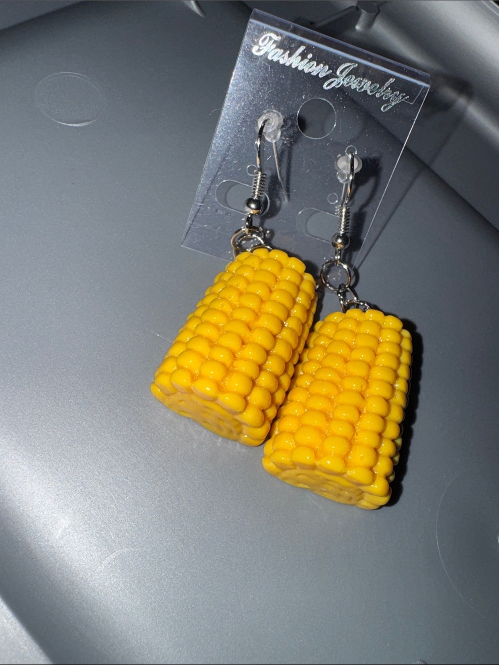 Hand me, fish style earrings, corn